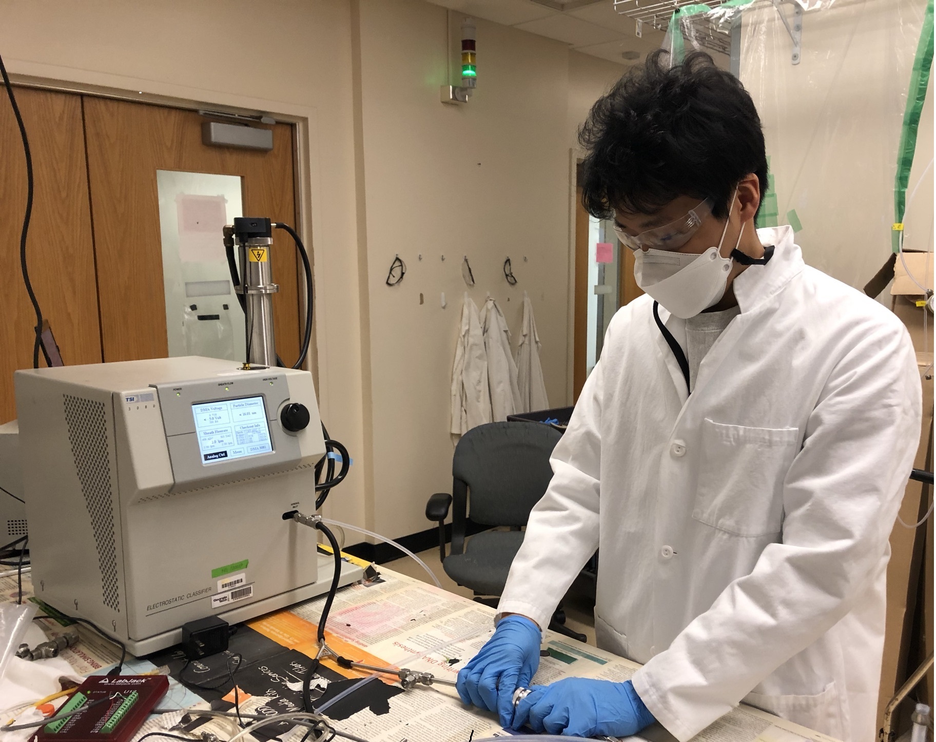 Graduate student Taekyu Joo setting up the filtration efficiency measurement system. (Credit: Fobang Liu, Georgia Tech) Graduate student Taekyu Joo setting up the filtration efficiency measurement system. (Credit: Fobang Liu, Georgia Tech)